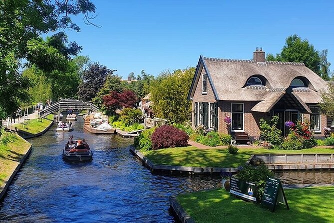 Giethoorn Day Tour from Amsterdam with Small Boat Ride - Car-free Giethoorn walking: canals, punter-style views, and thatched roofs