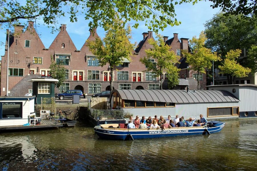 Groningen: Open Boat City Canal Cruise - Open Boat Realities: No Cover, Low Bridges, and Booking for Weather