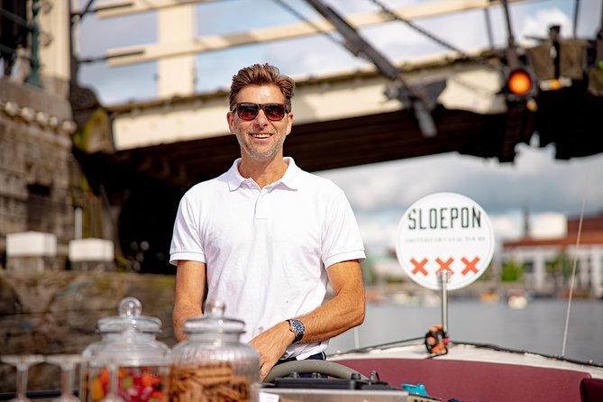 Guided Amsterdam Canal Cruise – Snacks & Drinks on board(1 Hour) - The guide experience: humor, facts, and practical pointers