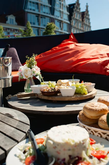 Haarlem Private Canal Tour with Bites and Unlimited Drinks - Unlimited drinks and fried bites, the on-board rhythm