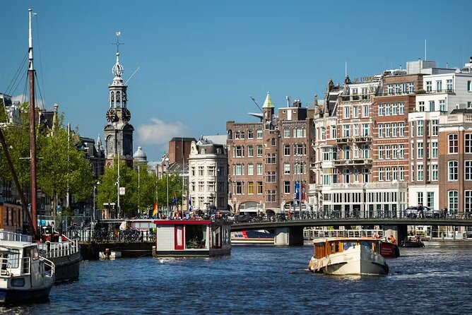 Highlights and Local Insights Canal Cruise Tour in Amsterdam - City Hall, the Rokin Canal, and those dancing-house facades
