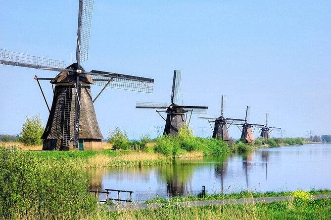 Kinderdijk Windmills and Delft Small-Group Tour from Amsterdam - Comfort and hydration: the included water, snacks, and long-day pacing