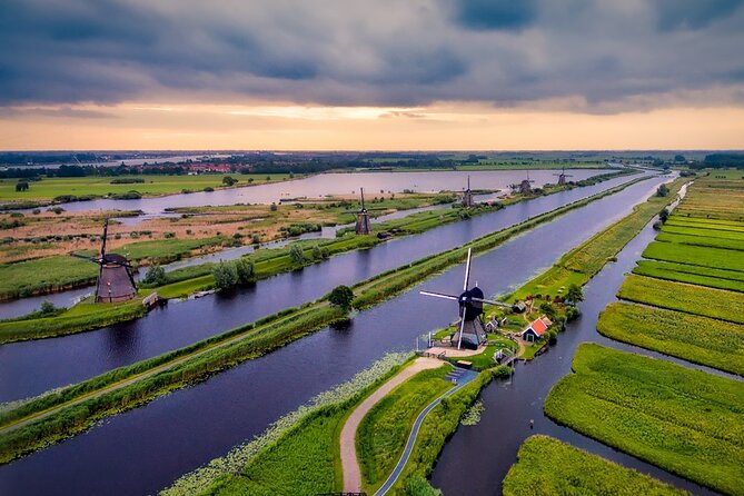 Kinderdijk Windmills and Delft Small-Group Tour from Amsterdam - Kinderdijk UNESCO: boats, working mills, and why it feels magical