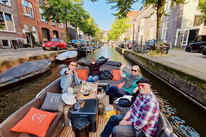 Private 90 Minute Amsterdam Canal Belt Exploration Cruise - Zuiderkerk, Munt Tower, and the flower market from the water