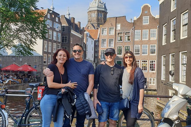 Private Amsterdam Red Light District and Coffee Shop Tour - Damrak to the Dam: Wooden-Pile Foundations and Real Amsterdam