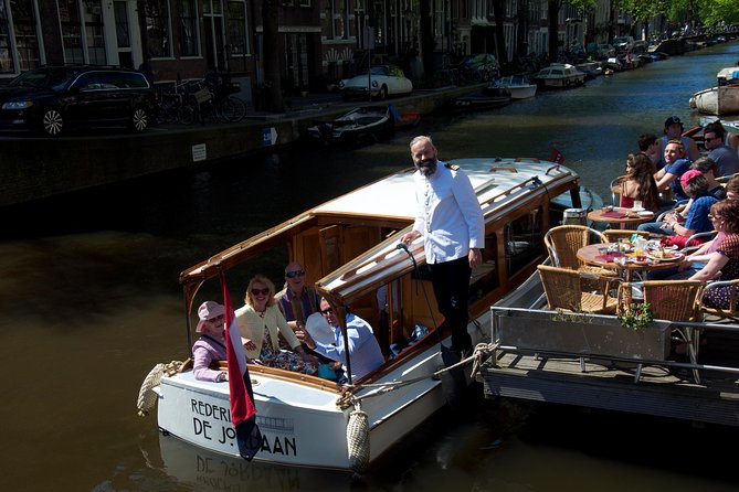 Private Champagne Canal Cruise in Amsterdam - Boat comfort, semi-open bar, and the snack table