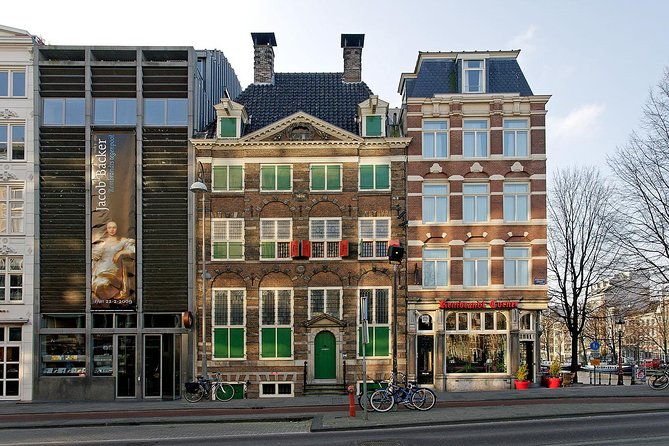 Rembrandt House & Neighborhood Exclusive Guided Walking Tour - Bloemenmarkt and the Munttoren: flower market, medieval gate, city evolution
