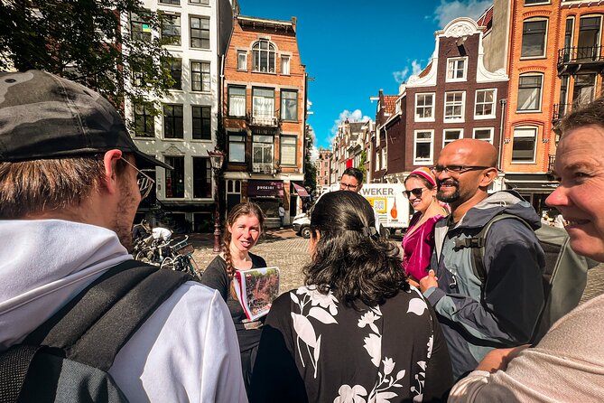 Small Group Walking Tour - Hello Amsterdam - Stop 3: Damrak, a True-or-False Game, and Canal-Side Amsterdam Views