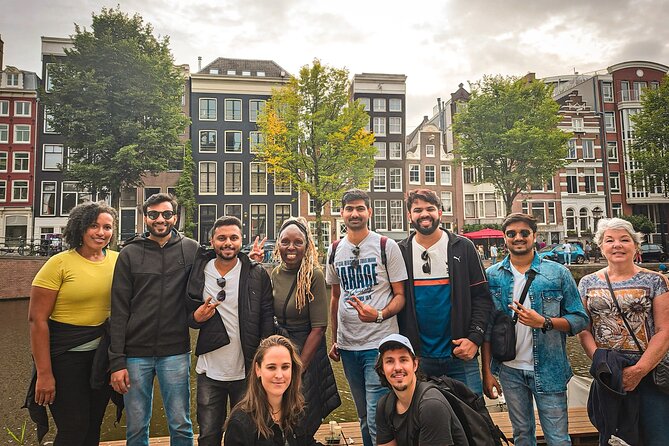 Small Group Walking Tour - Hello Amsterdam - Stop 1: Dam Square and Damstraat for the City’s Main Stage