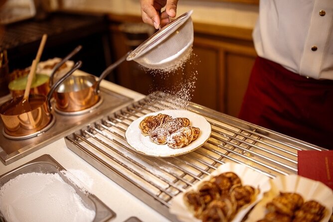 Top 10 Tastes of Amsterdam: Guided Walking Food Tour - Start at Nieuwezijds Voorburgwal, then warm up with poffertjes